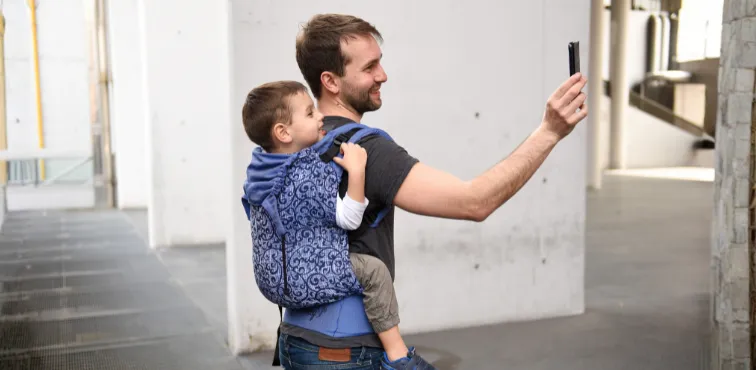 Agilo ergonomic baby carrier in different sizes worn with a child