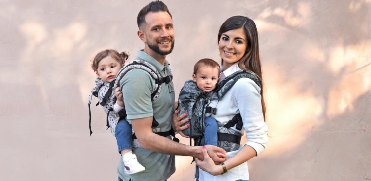 Regolo BabyMonkey adjustable ergonomic baby carrier worn with a baby