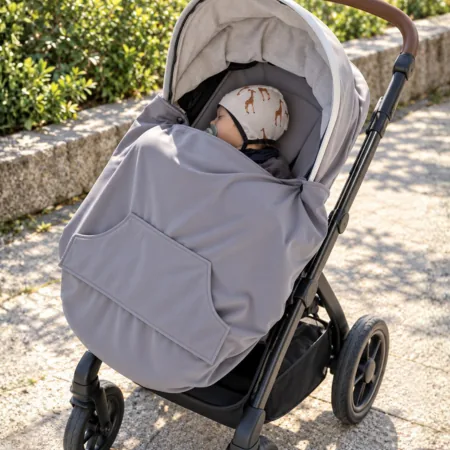 BabyMonkey Mid-Season Cover used as a stroller leg cover